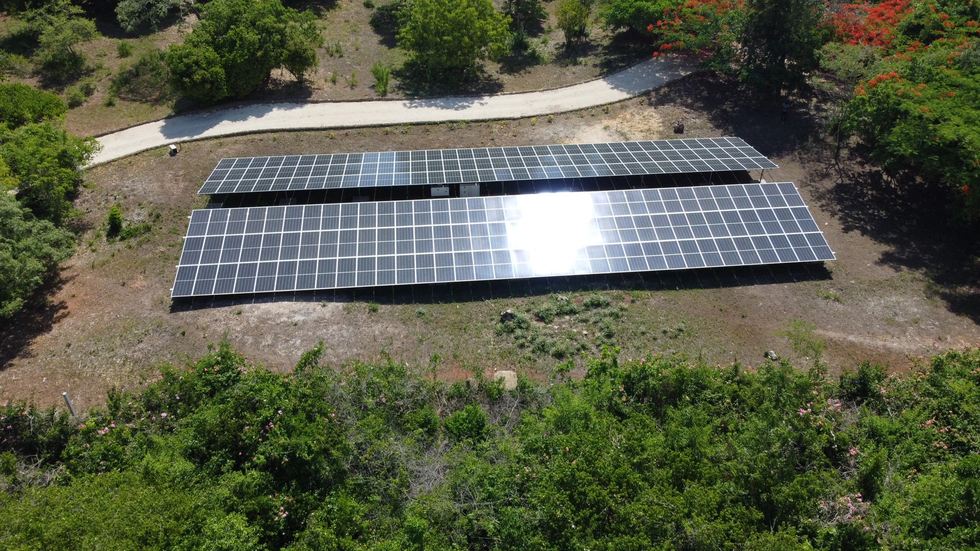 Kinondo Kwetu — ground-mount array in the estate grounds