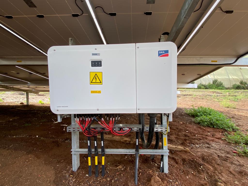 Waridi Flowers — SMA inverter station beneath the array